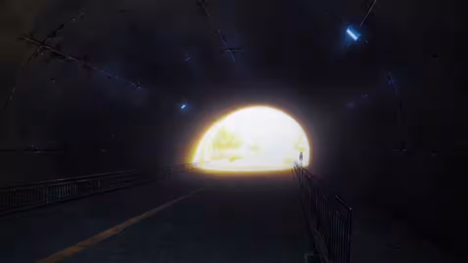 Yuka walking into a dark tunnel with a bright opening behind herself.