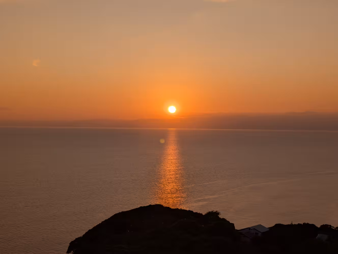 The sun setting over the ocean.