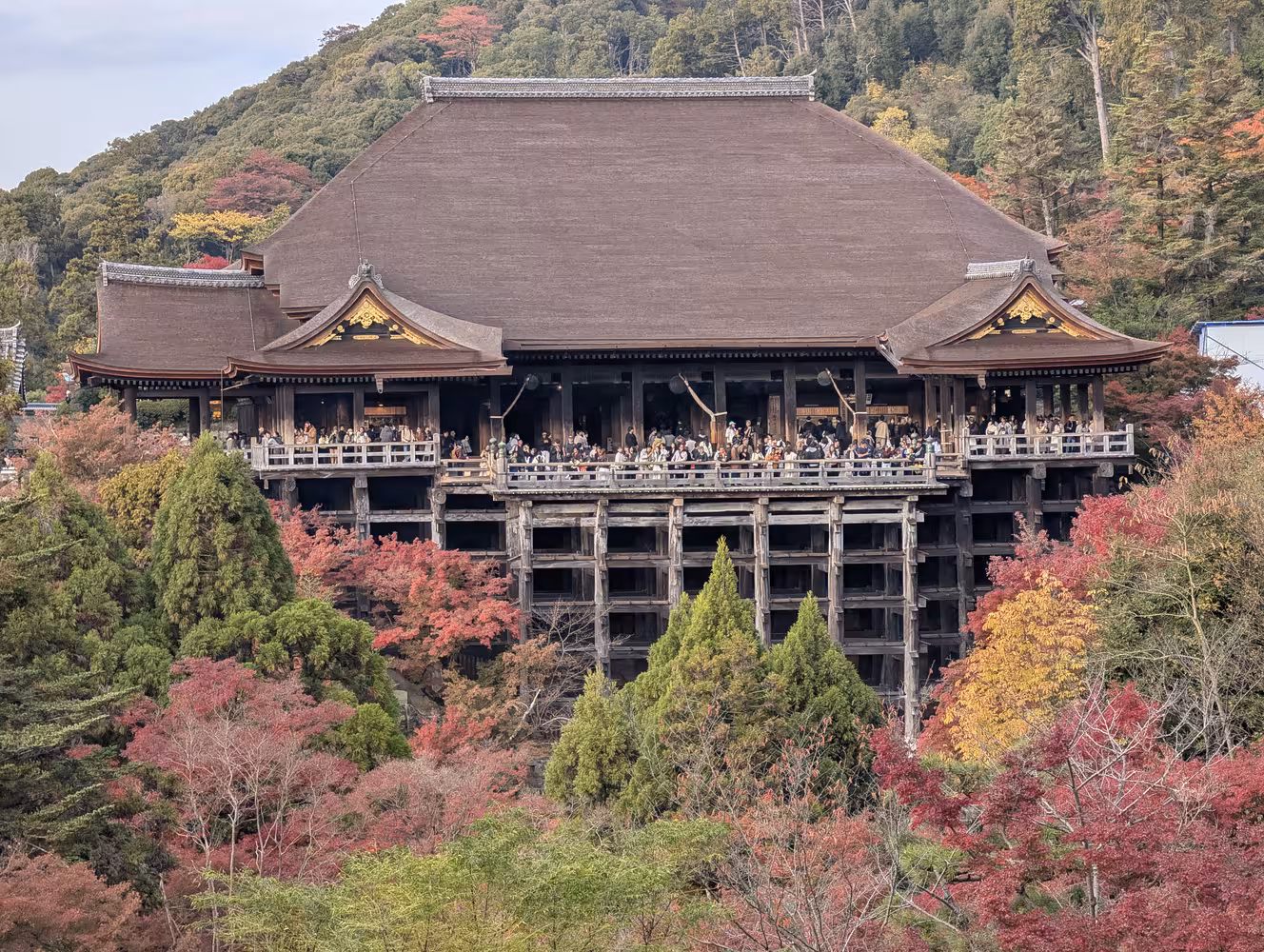 The main building from the other side of the valley on top of large wooden stilts.