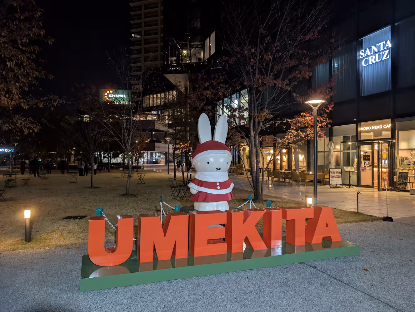 A ≈ 1m tall statue of Miffy on top of a sculpted text stating “Umekita”.
